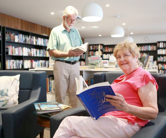 A retired couple enjoying their time together in the Village library